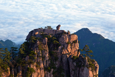 Stone Monkey Gazing over the Sea of Clouds - View of Huangshan, Anhui Province, China. Of all the notable mountains in China, it is probably the most famous to be found in the south of Anhui province.の写真素材