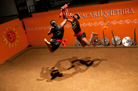 KERALA, INDIA - JANUARY 18, 2016: Indian fighters performing Kalaripayattu marital art demonstrationのeditorial素材