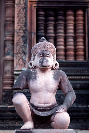 Ancient statue of Hindu God Hanuman in Banteay Srey Temple in Angkor Area, Cambodia. Banteay Srey is a 10th century Cambodian temple dedicated to the God Shivaの写真素材
