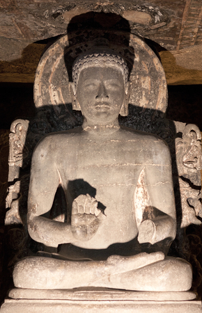 Ancient statue of Buddha in Ajanta caves, Indiaの写真素材
