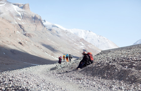 NGARI, TIBET - MAY 5, 2014: Tibetan pilgrim on the Kora trail around Mount Kailash in the Himalaya in Tibet Autonomus Region of Chinaのeditorial素材
