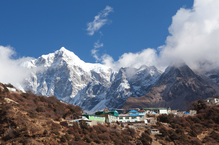 Mount Thamserku and village on the way to Everest base camp, Khumbu, Sagarmatha National Park, Nepal Himalayaの写真素材