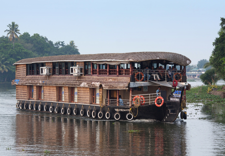 ALLEPPEY, INDIA - NOVEMBER 6, 2016: Tourists on Houseboat floating on backwaters in Kerala stateのeditorial素材