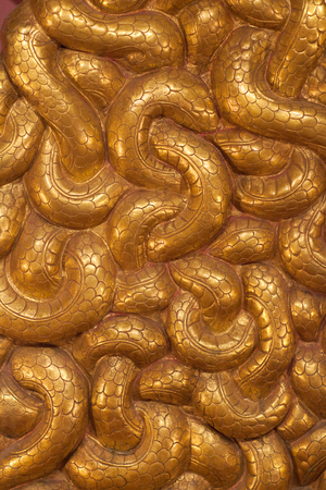 Ancient bas-relief with Naga Figures - Snakes and Serpents. Detail of throne in royal palace in Patan, Kathmandu valley, Nepalのeditorial素材