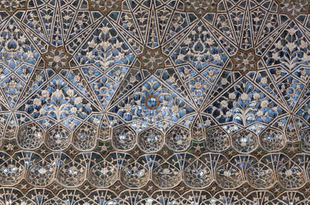 JAIPUR, INDIA - JANUARY 3, 2019: Ceiling decoration at Sheesh Mahal palace (Hall of Mirrors), also called Jai Mandir, in Amber Fort, Rajasthan stateのeditorial素材