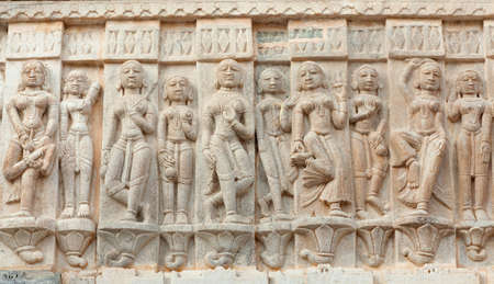 Ancient bas-relief with Apsaras at famous ancient Jagdish Temple in Udaipur, Rajasthan, India.の写真素材