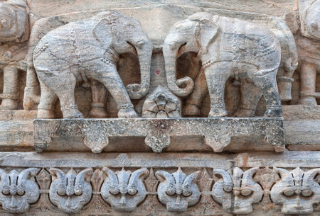 Bas-relief with elephants at famous ancient Jagdish Temple in Udaipur, Rajasthan, India. It has been...
