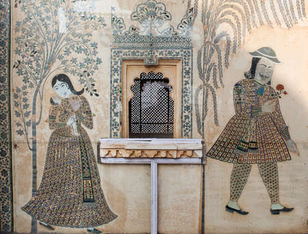 UDAIPUR, INDIA - JANUARY 5, 2019: Ornate facade of wall overlooking an inner Peacock courtyard in Udaipur City Palace, Rajasthan stateのeditorial素材