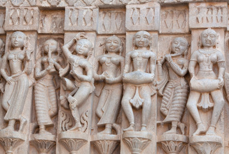 Ancient bas-relief with Apsaras and musicians at famous ancient Jagdish Temple in Udaipur, Rajasthan, India. It has been in continuous worship since 1651.の写真素材