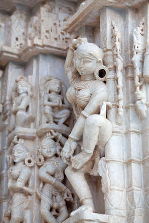 Ancient bas-relief with Apsaras and musicians at famous ancient Jagdish Temple in Udaipur, Rajasthan, India. It has been in continuous worship since 1651.の写真素材