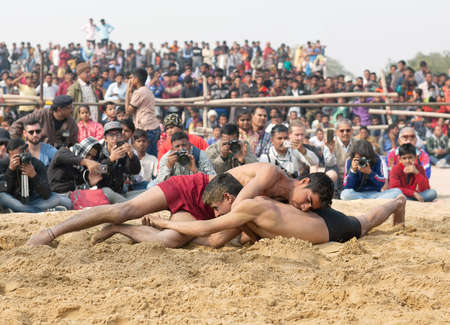 BIKANER, INDIA - JANUARY 12, 2019: Indian wrestlers doing their practice during Camel festival in Rajasthan. Pehlwani, or kushti is a form of wrestling from the Indian subcontinent.のeditorial素材
