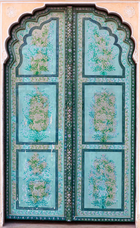JAIPUR, INDIA - JANUARY 3, 2019: Ancient green doorway in Hawa Mahal palaceのeditorial素材