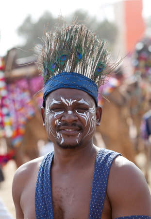 BIKANER, INDIA - JANUARY 12, 2019: Indian man from Nagaland in traditional costume poses for a photo during festival. Camel Festival begins with a colourful procession of camels, musicians, dancers.のeditorial素材