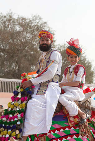 BIKANER, INDIA - JANUARY 12, 2019: Indian Rajasthani men in traditional clothes poses for a photo during Camel Festival in Rajasthan stateのeditorial素材