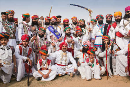 BIKANER, INDIA - JANUARY 11, 2019: Indian men with a long mustaches in national clothes poses for a photo during Camel Festival in Rajasthanのeditorial素材