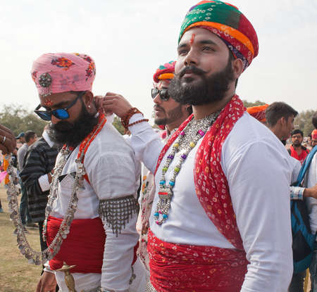BIKANER, INDIA - JANUARY 12, 2019: Indian Rajasthani man in traditional clothes poses for a photo during Camel Festival in Rajasthanのeditorial素材