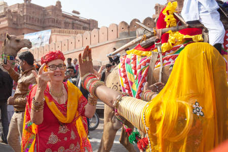 BIKANER, INDIA - JANUARY 12, 2019: People dancind on the street during festival in Rajasthan state. Camel Festival begins with a colourful procession of camels, musicians and dancersのeditorial素材