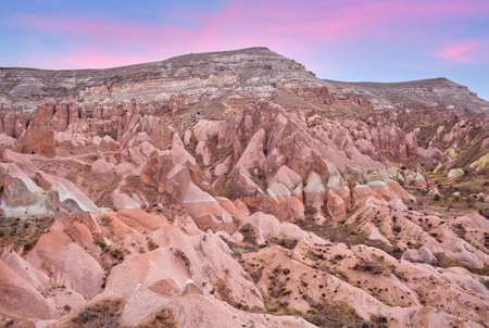 View from Aktepe Hill over Red valley in Cappadocia, Turkey. Goreme National Park. Cappadocian Region with its valley, canyon, hills located between the volcanic mountains Erciyes, Melendiz and Hasanの写真素材