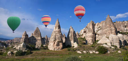 Colorful hot air balloons flying in blue sky over Cappadocia, Central Anatolia, Turkey.の写真素材