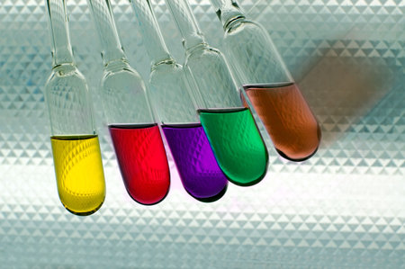 five flask with different-coloured chemical liquids