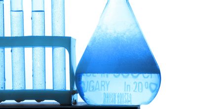 chemistry tube with micro-drop and foam isolated on White backgroundの写真素材