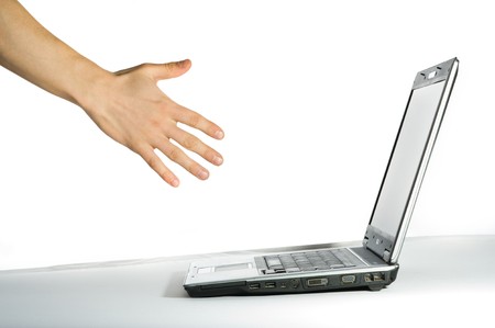 Hand pointing to the computer. Isolated over white backgroundの写真素材