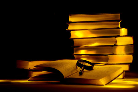 Mysterious library. Magnifier on the open book