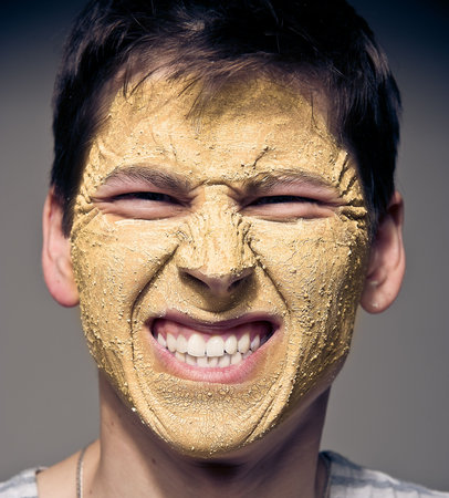 Close-up portrait of funny man with facial mask and glasses