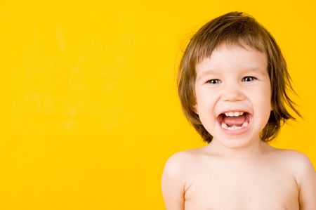 Cute baby laughing and showing the teethの写真素材