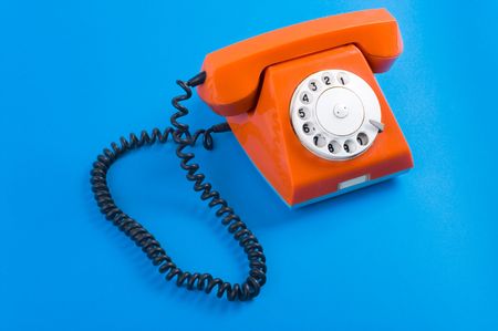 Picture of old fashioned telephone over blue backgroundの写真素材