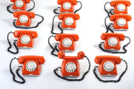 Especial phone looks forward to hearing. Close up large group of orange telephonesの写真素材