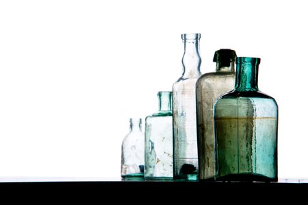 old bottles in a row on whiteの写真素材