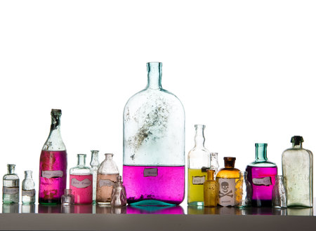 Magic spells. Antique bottles over white background
