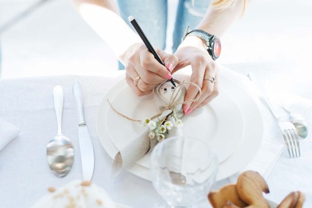 Simple festive Easter table setting with napkin Easter Bunny for one personの写真素材