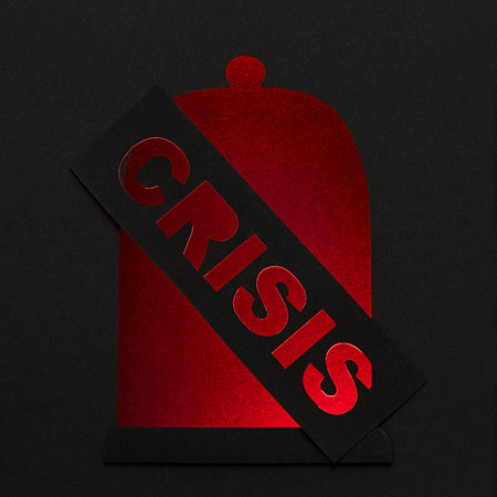 Emergency concept. Paper bell and sign with diagonal perforated inscription saying crisis. All in...