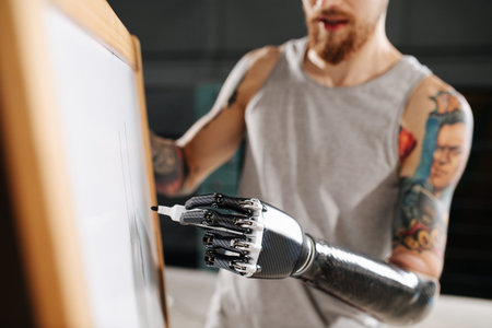 Image of a cyborg man with bionic hand writing on a board with permanent marker
