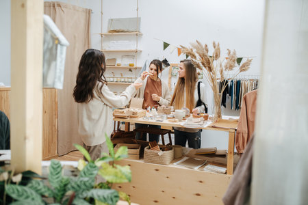 Longshot of young women in ecological shop choosing between cosmetic productsの写真素材