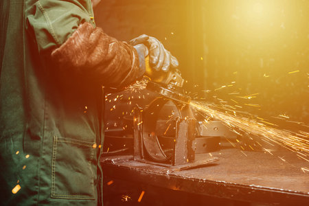 angle grinder at work, sparks flying away in the process