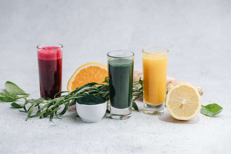 Home made detox drinks from dissolved powder in composition with ingredientsの写真素材