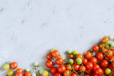 Red cherry tomatoes. Top view with copy space.の写真素材