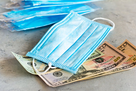 Medical mask equivalent to a monetary unit. Pandemic virus COVID-19.Antiviral medical mask for...