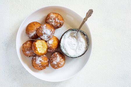 Donuts. Homemade cakes made from curd balls. Freshly made donuts from cottage cheese with powdered sugar. Cottage cheese donuts. Selective focusの写真素材