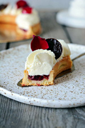 Shortcrust tart with berry filling (fruit coolie, compote) and Chantilly cream (whipped cream),...