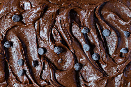Chocolate texture (mousse, ganache) with pieces of chocolate drops. Raw dough for making American...