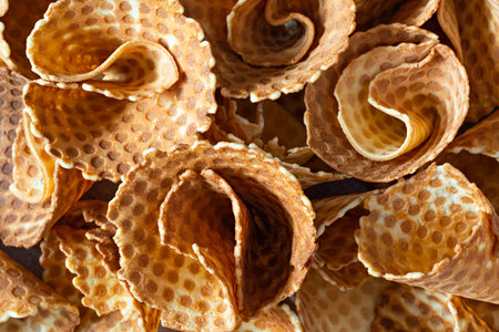 Background of waffle cones, delicious confectionery pastry, waffle cone for ice cream, top view.の写真素材