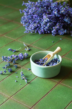 Bouquet of fresh lavender on a green textural background. Fragrant flower of medicinal herbs, copy space.の写真素材
