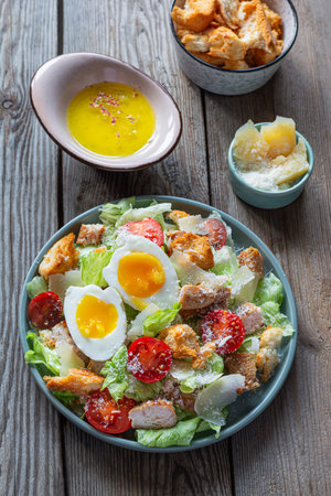 Fresh Caesar salad with chicken. Healthy breakfast, brunch.の写真素材