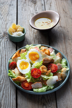 Fresh Caesar salad with chicken. Healthy breakfast, brunch.の写真素材