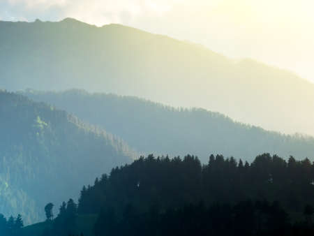 Mountain hills in the mist during sunset