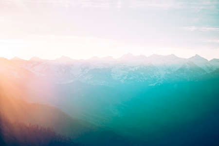 Mountain peaks landscape at sunset.